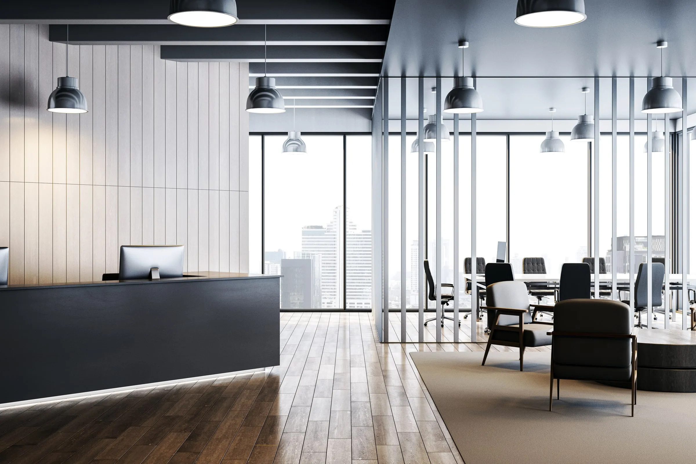 Modern office reception area with a white desk, glass partitions and a view to a meeting room