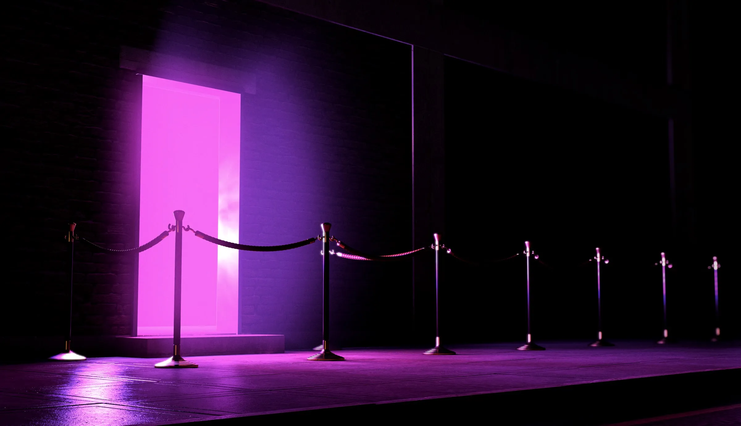 Brass stanchions and velvet ropes leading to a doorway lit in bright magenta on a dark street at night
