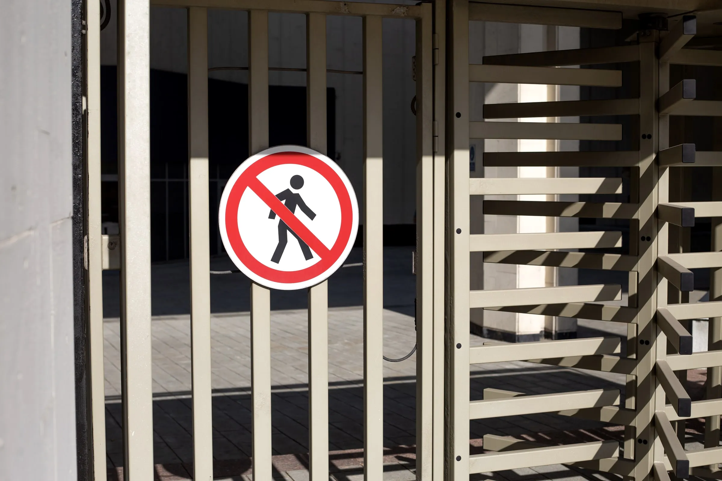 Turnstile gate with a no-entry sign