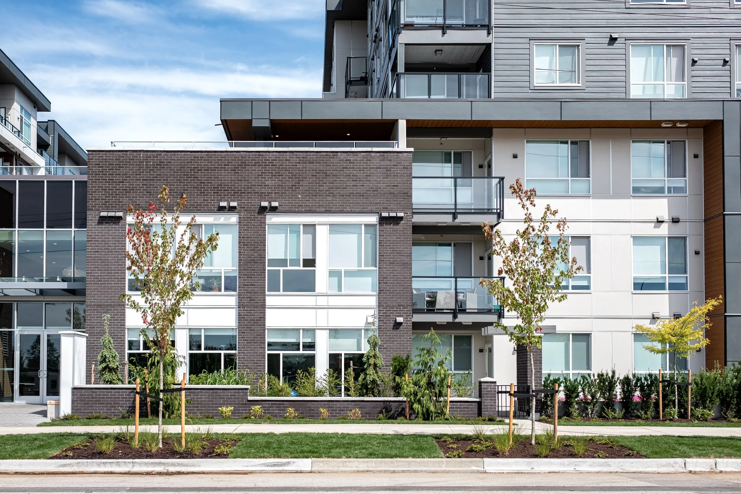 Modern apartment community with landscaped grounds