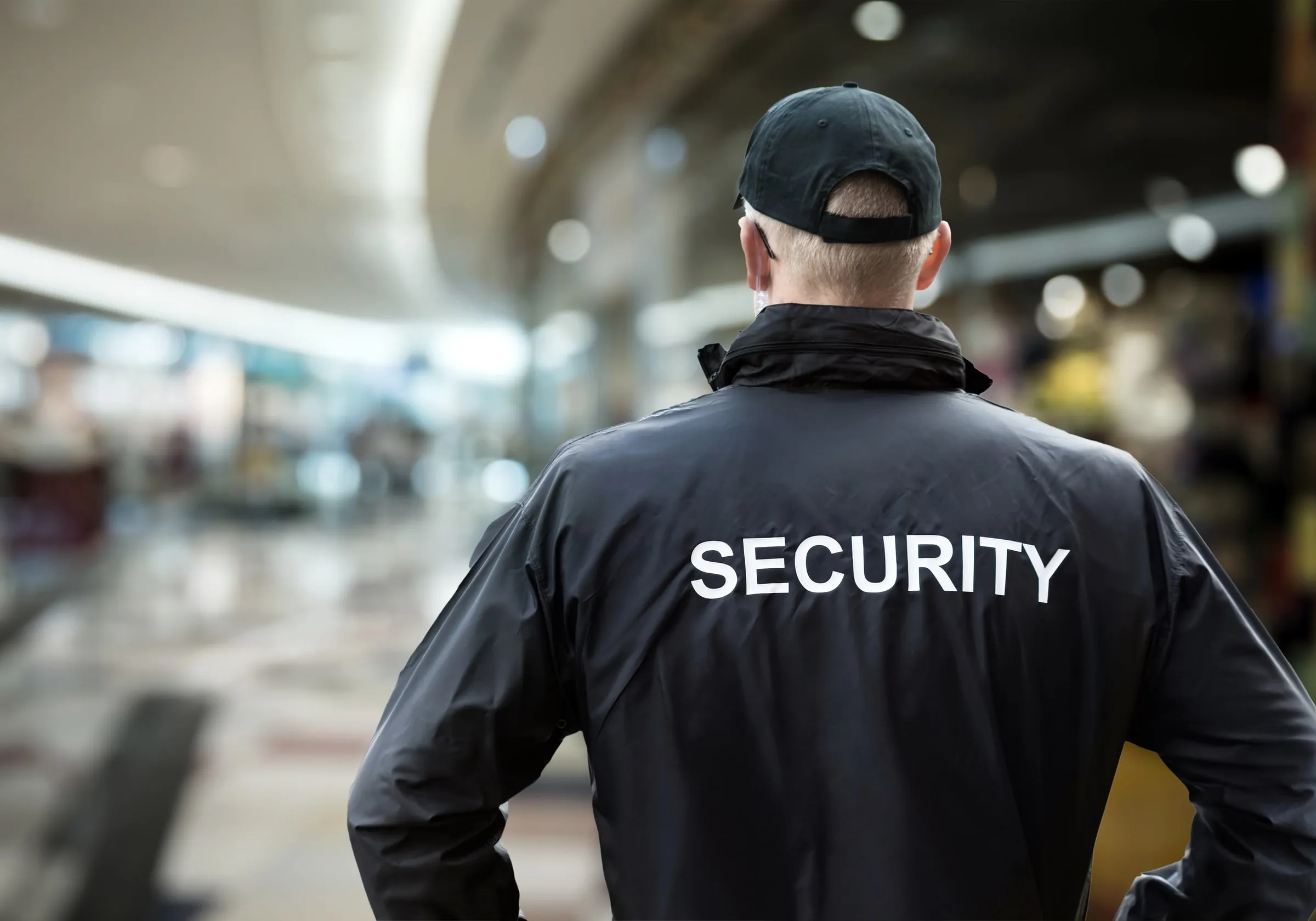 Unarmed security officer patrolling a retail center